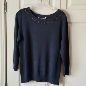 Soft sweater with grommet accents